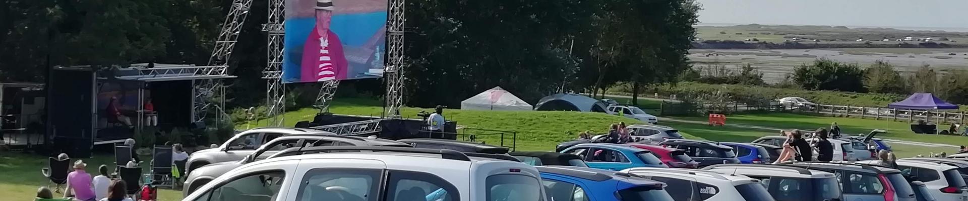 Author on stage durin the drive in festival